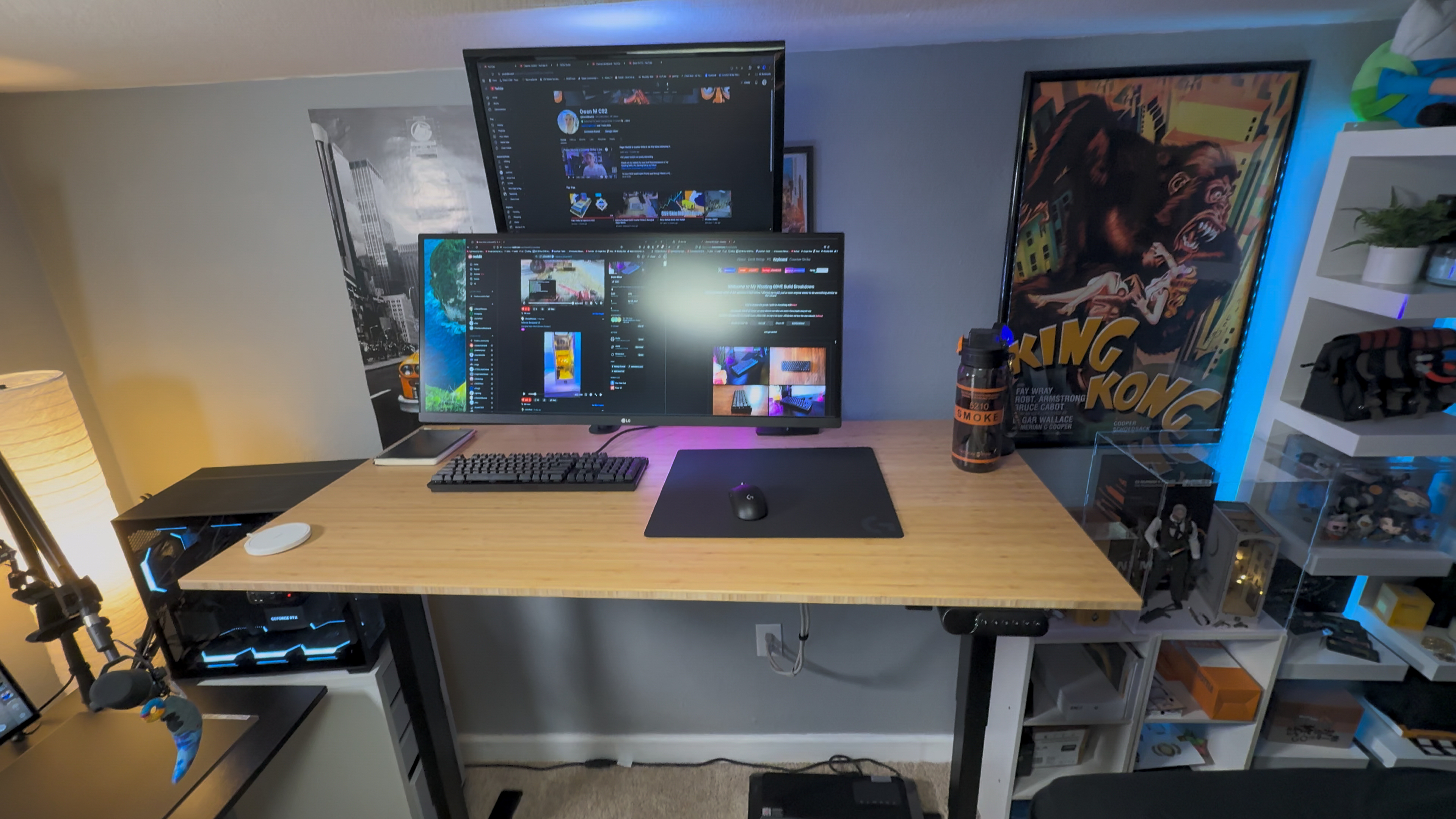 Gaming setup with 2 monitors tv wooting keyboard pc in background